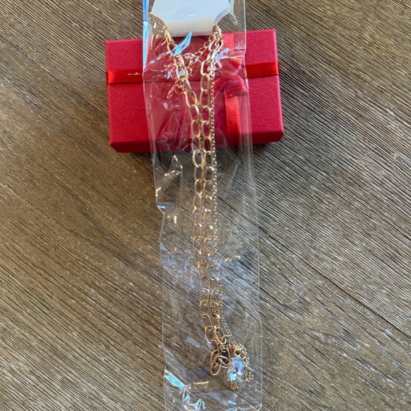 Gold Tone Layered Necklace with Crystal Teardrop Pendant - Picture 7 of 10